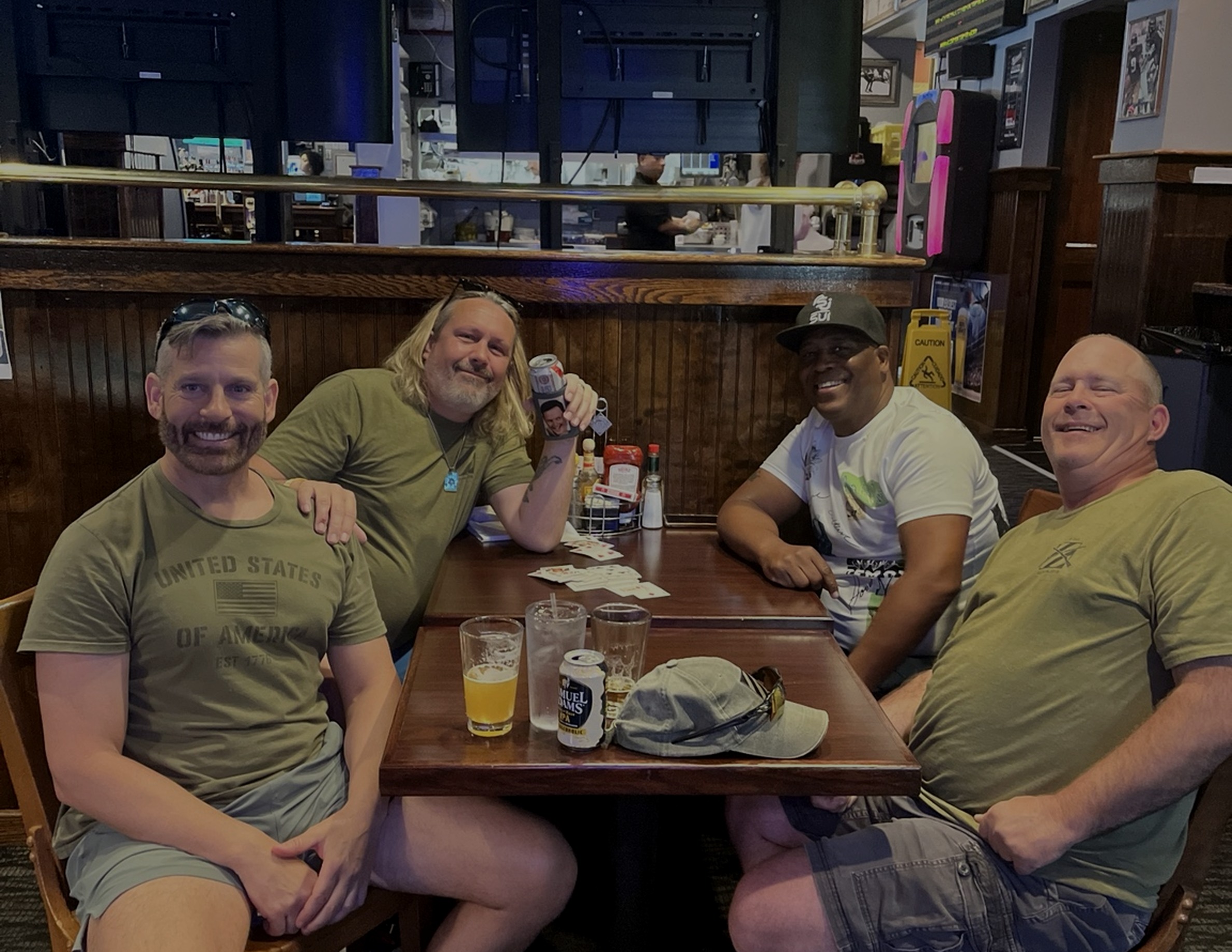 Army friends gathered around a table at a Washington, D.C. reunion