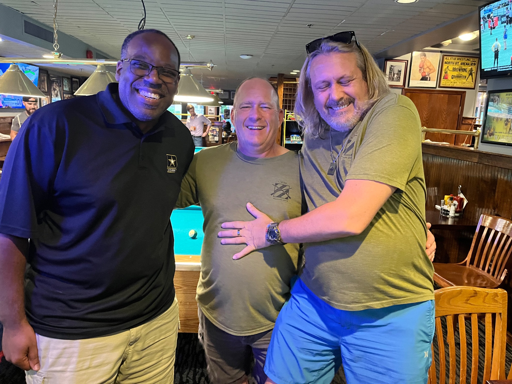 Porter, JP, and Dr. Hudson laughing together at Scotch and Scissors in Washington, D.C.