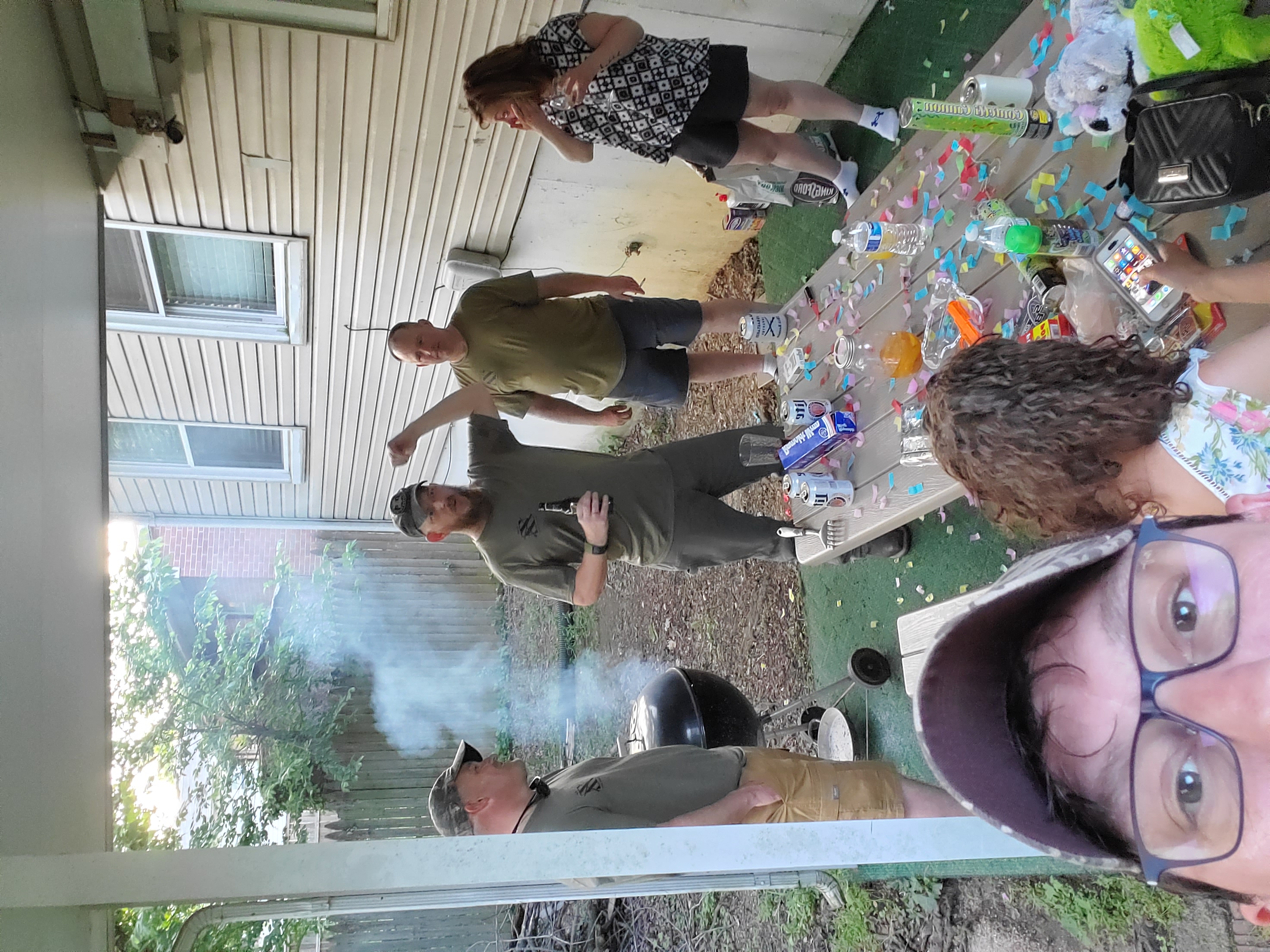 Friends gathered around a backyard table after a weekend in Washington, D.C.